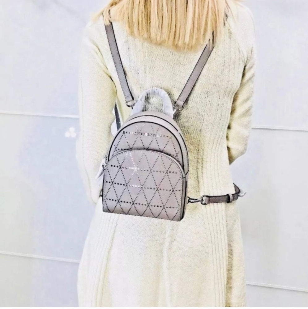 Michael Kors Mini Abbey Convertible Saffiano Perforated Crosshatch Backpack Gray